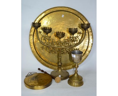 East European / Russian brass communion cup, brass five light ecclesiastical candelabra, circular engraved brass tray and a b