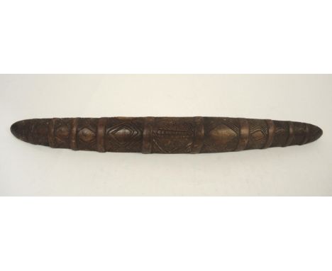 Late 19th / early 20th Century Aboriginal parrying shield with typical carved decoration, 77.5cm long