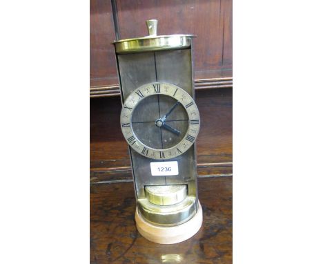 Mid 20th Century brass mantel clock by Shatz, with a cylindrical case and quartz movement