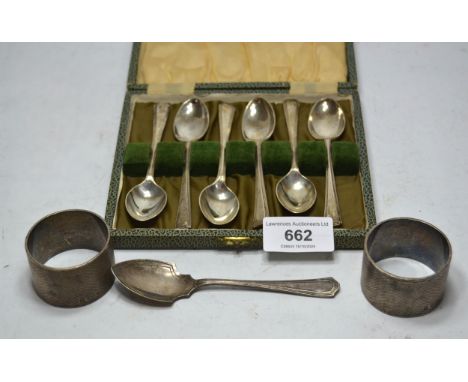 Pair of engine turned silver napkin rings, cased set of six silver coffee spoons and a silver jam spoon, 7oz t