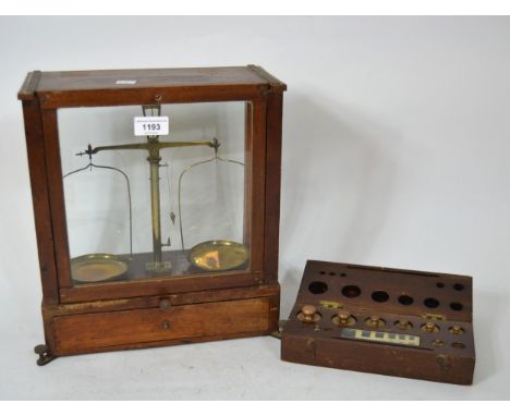 Mahogany and glazed set of laboratory scales, together with a cased part set of weights