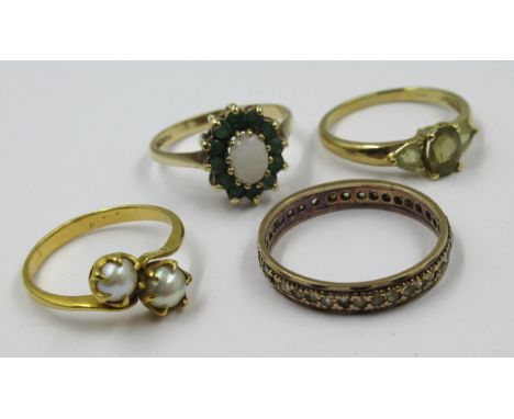 Three various 9ct gold dress rings, 8g together with an unmarked eternity ring (at fault), 2.5g