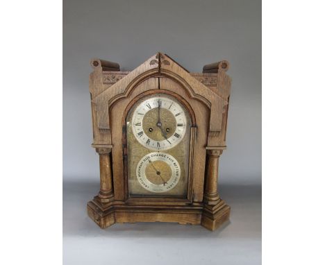 Late 19th century oak Arts &amp; Crafts ecclesiastical board room clock, the architectural case with arched glass front enclo