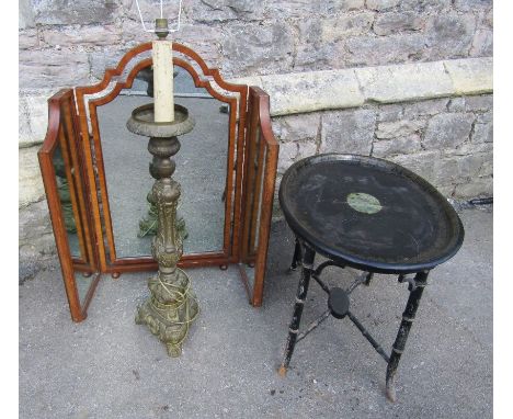 An oval japanned toile ware tin tray raised on a Regency style ebonised simulated bamboo stand with x framed stretcher togeth