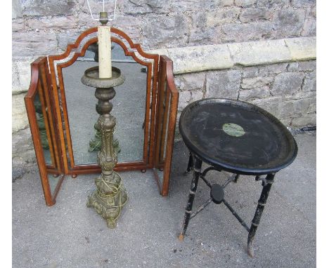 An oval japanned toile ware tin tray raised on a Regency style ebonised simulated bamboo stand with x framed stretcher togeth