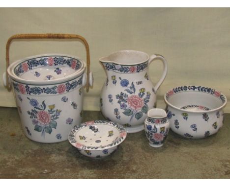 A part white glazed ceramic Bristol pottery jug and basin set with floral detail