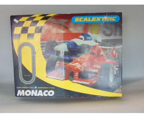 Scalextric Monaco boxed racing game with various parts and accessories, together with a Cased Antoni violin with two bows, tw