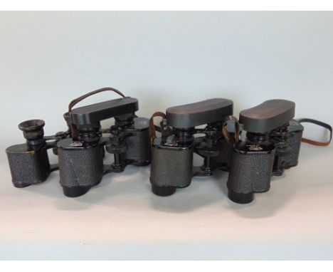 Four pairs of Busch binoculars to include three pairs of Sollux 8x30 all with crown markings plus an Ultralux 8x24 with arrow