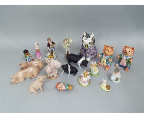 A Rye Pottery cat by Joan De Bethell, 18.5cm tall, together with two similar teddies, a collection of ceramic pigs including 