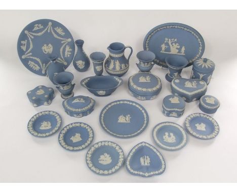 A quantity of blue ground Wedgwood Jasper wares including trinket boxes and covers, oval tray, vases, etc