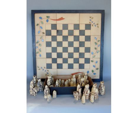 The Lewis Chess Set, together with interesting chess board made of terracotta tiles 