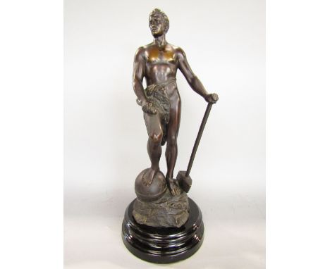 Alfred Muller-Crefeld - 'The Blacksmith' bronze character group of a standing athletic gentleman with a globe under one foot,