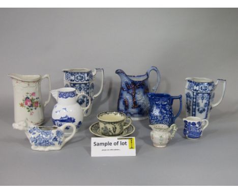 A collection of 19th century and later jugs including a Coalport Caughley reproduction example, showing the Iron Bridge, Roya