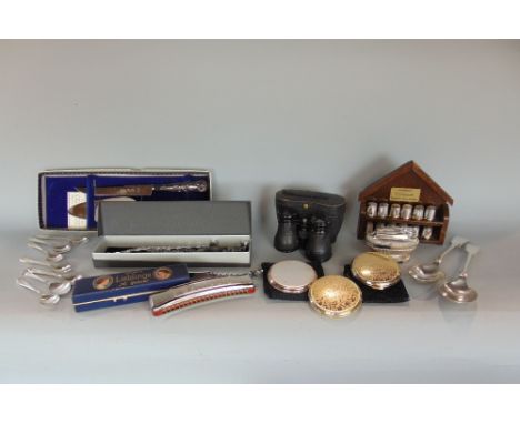 A box of interesting items to include silver plated tables wares, lighter, thimbles, binoculars, watch straps, etc