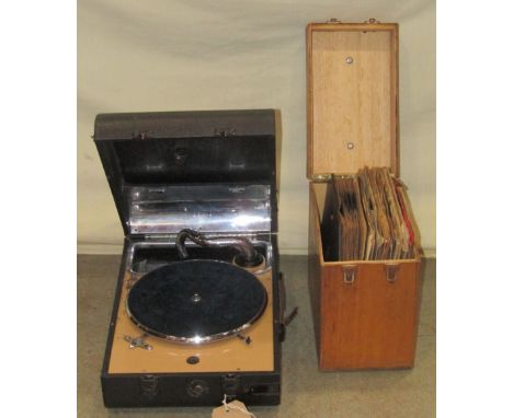 A vintage cased portable Decca 30 windup gramophone together with a small wooden case containing various records (2)
