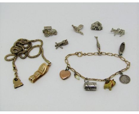 Antique 9ct bracelet hung with a 9ct heart charm and various silver charms to include a Jack-in-the-box devil example, plus f