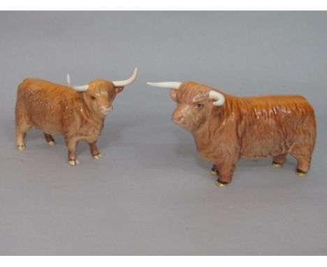 A Beswick highland bull and highland cow