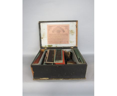 German cased nursery magic lantern with various slides, the box 32cm wide