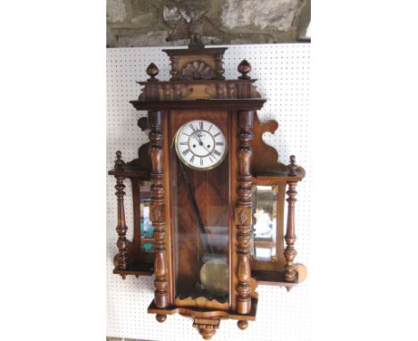Vienna regulator wall clock, the architectural case flanked by twin bevelled mirrors and shelves, the twin train enamel dial 