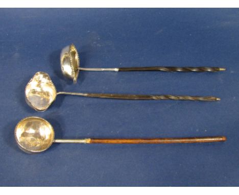 Two similar Georgian horn handled and silver toddy ladles (1 af) together with a further wooden handled toddy ladle fitted wi