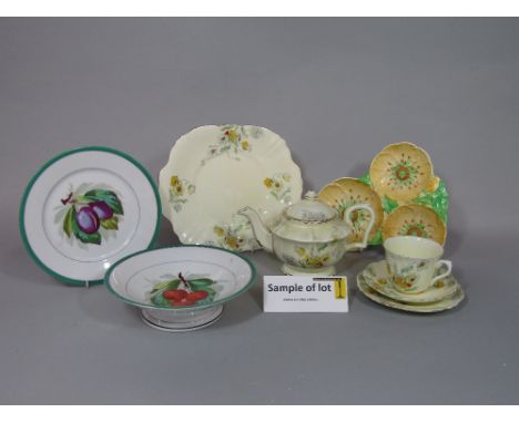 A collection of Crown Staffordshire teawares with yellow poppy detail comprising teapot, milk jug, sugar bowl, cake plate, fi