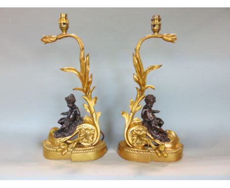 Good pair of bronze and ormalu chanets, modelled as reclined cherubs on rococo type foliate bases, 50cm high (2)