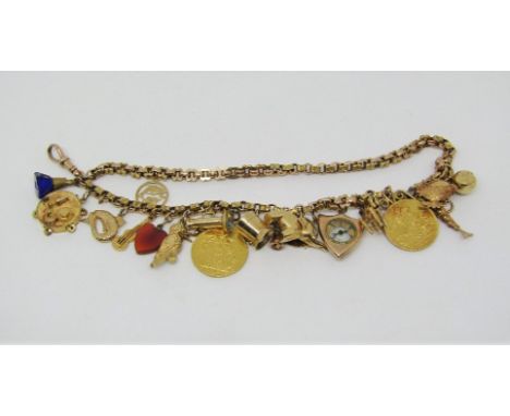 Good antique 9ct fancy link charm bracelet hung with two sovereigns dated 1898 and 1891, an interesting selection of 9ct char