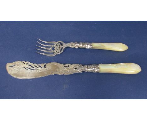 Good quality silver and mother of pearl handled fish serving knife and fork, the blade and fork both with engraved and pierce