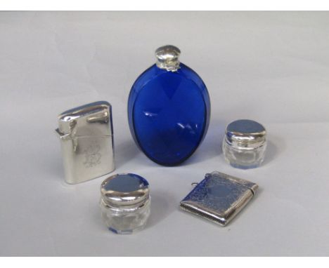Mixed bijouterie lot to include a silver lighter, a silver vesta case, two silver topped jars and a further silver lidded blu