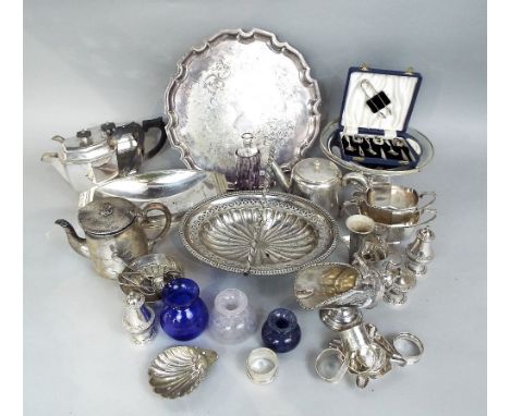 A mixed collection of silver and silver plate to include a silver ashtray, five silver napkin rings (displayed in cabinet) to