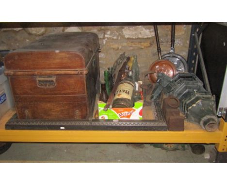 One lot of miscellaneous items to include a dome top tin trunk and contents, a cast iron fire curb, old advertising bottles, 