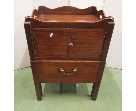 George III mahogany tray top commode, the front elevation enclosed by two doors over a pull out base, with simple string line