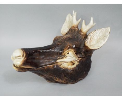 An unusual continental ceramic tureen and cover, naturalistically modelled as a stags head, with printed mark to base Nanchu?