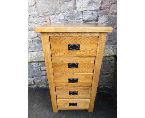 A contemporary light oak five drawer pedestal chest, 56cm wide x 103cm high