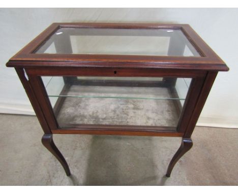 An inlaid Edwardian mahogany floorstanding vitrine/bijouterie table of rectangular form with glazed hinged fall front and sur