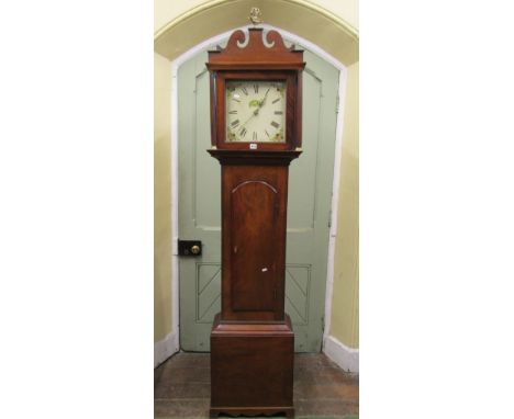 A regency mahogany longcase clock, the hood with reeded columns, enclosing a square painted dial with 30 hour striking moveme