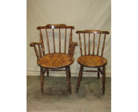 A set of eight (6&amp;2) Swedish stained beechwood stick back dining chairs with circular seats raised on splayed turned supp