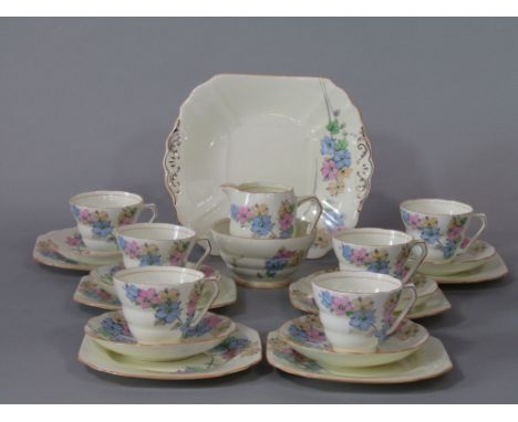 A Fenton Art Deco tea service with floral detail comprising milk jug, sugar bowl, cake plate, six cups, six saucers and six t