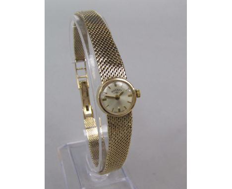 Ladies 9ct Rotary cocktail watch, the champagne dial with baton markers, 9ct mesh strap, 21 grams gross