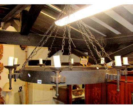 A contemporary old English style iron work hanging ceiling light/electrolier of hooped form with eight torch shaped lights, c