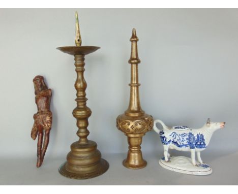 A mixed lot to include a carved lime wood study of Christ, a pricket candlestick, an Islamic type heavy cast bronze finial an