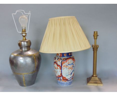 Japanese imari lobed porcelain baluster table lamp, together with a further eastern white metal and brass example and a furth