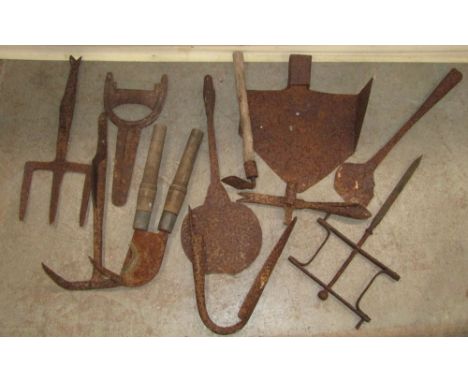 A small collection of vintage 19th century and later iron work to include boot scraper, iron bracket/crane, including poachin