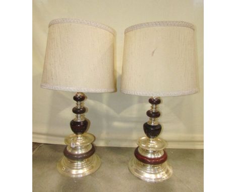 A pair of substantial polished wood and light metal table lamps with knopped stems and flared circular bases, 55 cm high appr