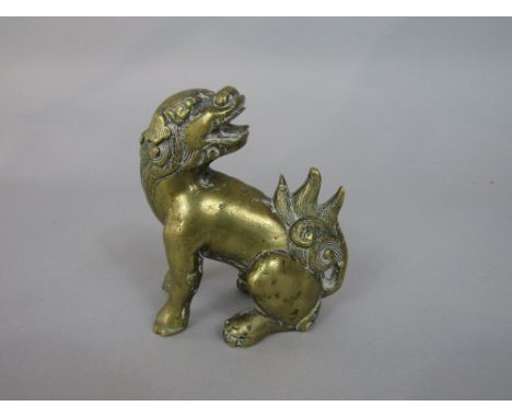Chinese polished cast bronze figure of a seated dog of fo, 10cm high
