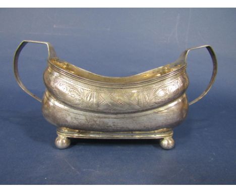 George III Irish silver twin handled boat shaped sucrier, with engraved band of geometric patterns to include diaper work and