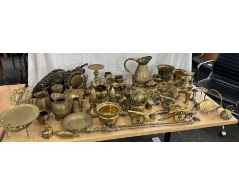 Large selection of brass ware items to include jugs, ornaments, oil lamps, canons, egg timer etc