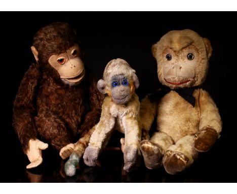 Steiff (Germany) Jocko Monkey, amber and black glass eyes, cream felt face, cream felt hands and feet, 25cm high, c.1950; oth