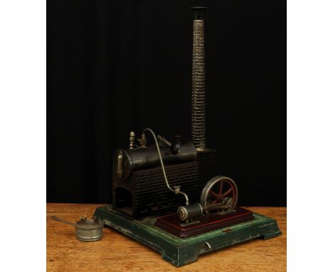 An early 20th century live steam horizontal stationary steam engine, fitted with a single cylinder and six spoke flywheel pai