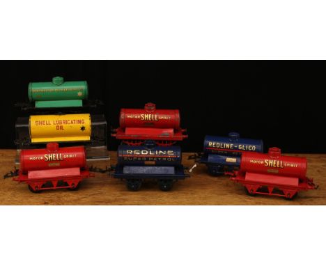 A collection of Hornby O Gauge tinplate tank wagons, comprising petrol tank wagon 'REDLINE-GLICO, SUPER PETROL', unboxed; oil